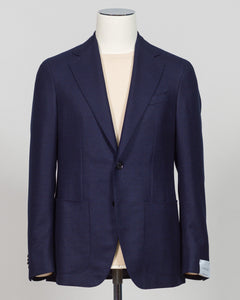 Caruso flannel sport jacket crafted in navy wool with tailored precision. This versatile layer features refined construction detailing and a structured silhouette designed for sophisticated menswear styling. Soft woolen fabric offers warmth and texture while maintaining a polished appearance, making it an essential piece for layering across seasons. Ideal for both professional and casual refined occasions, this jacket pairs seamlessly with dress trousers, chinos, or tailored separates. The classic navy tone