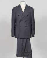 A dark gray double-breasted suit with a subtle micro-check pattern, displayed on a mannequin against a light gray background. Refined elegance in a timeless double-breasted silhouette. This Caruso suit pairs the warmth of quality flannel with sophisticated tailoring, delivering understated luxury suited to both boardroom and evening occasions. Dark grey ensures versatility across your wardrobe while the construction speaks to meticulous craftsmanship and enduring style.Caruso Double-Breasted Flannel Suit / 