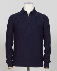 A dark navy blue ribbed knit polo sweater displayed on a white mannequin torso against a light gray background.  Timeless ribbed polo in navy from Gran Sasso, Italian craftsmanship meets understated elegance. Refined knit construction sits comfortably between casual and formal wear. An essential layer for the discerning wardrobe. Gran Sasso Ribbed Polo / Navy
