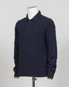 A timeless polo crafted from luxurious Donegal yarn, blending Italian heritage with understated elegance. The textured weave creates subtle visual interest while maintaining the versatility of a classic navy foundation. Refined construction and premium materials make this piece equally at home in casual settings or layered for sophisticated warmth. A staple worthy of investment.