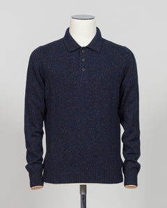 A timeless polo crafted from luxurious Donegal yarn, blending Italian heritage with understated elegance. The textured weave creates subtle visual interest while maintaining the versatility of a classic navy foundation. Refined construction and premium materials make this piece equally at home in casual settings or layered for sophisticated warmth. A staple worthy of investment.