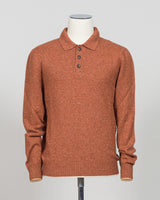 A timeless polo crafted from luxurious Donegal yarn, blending Italian heritage with understated elegance. The textured weave creates subtle visual interest while maintaining the versatility of a classic orange foundation. Refined construction and premium materials make this piece equally at home in casual settings or layered for sophisticated warmth. A staple worthy of investment.