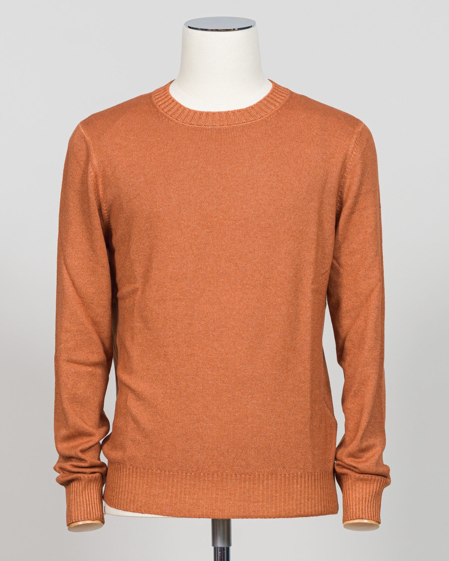 Italian luxury knitwear in a warm vintage orange. Gran Sasso's refined crewneck delivers timeless sophistication with superior craftsmanship—a versatile layering piece that pairs effortlessly with tailored trousers or casual separates. Premium construction ensures lasting comfort and durability. Gran Sasso Vintage Crewneck / Orange