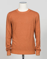 Italian luxury knitwear in a warm vintage orange. Gran Sasso's refined crewneck delivers timeless sophistication with superior craftsmanship—a versatile layering piece that pairs effortlessly with tailored trousers or casual separates. Premium construction ensures lasting comfort and durability. Gran Sasso Vintage Crewneck / Orange