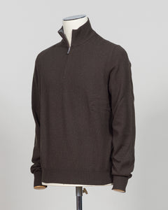 Gran Sasso Half-Zip Knit in rich dark brown, a timeless layering essential for the refined wardrobe. This Italian-crafted piece offers sophisticated simplicity with a comfortable half-zip construction, perfect for transitional styling. The knit's subtle texture and classic colorway pair effortlessly with tailored trousers or casual wear. Expertly finished with attention to detail throughout, this sweater delivers understated elegance and versatility season after season.