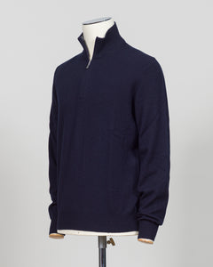 Elevate your everyday layering with this essential half-zip knit from Gran Sasso. Crafted from premium Italian yarn, the navy colorway offers versatility across seasons and occasions. The half-zip silhouette provides adaptable warmth, while the refined construction delivers the understated luxury Gran Sasso is known for. Perfect for layering beneath tailored blazers or wearing standalone with dress trousers.