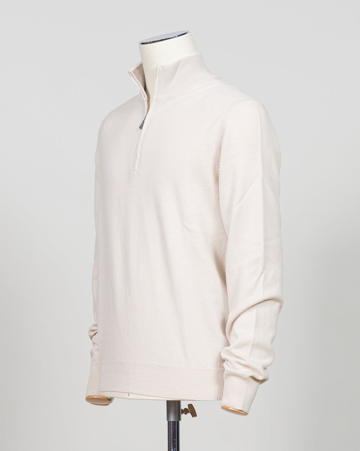 Refined Italian knitwear with timeless appeal. This Gran Sasso half-zip features a supple construction in bone white, designed for layering versatility and everyday sophistication. The relaxed silhouette pairs seamlessly with tailored trousers or casual wear, while premium yarn quality ensures durability and comfort through seasons of wear. A refined essential for the discerning wardrobe.