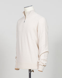 Refined Italian knitwear with timeless appeal. This Gran Sasso half-zip features a supple construction in bone white, designed for layering versatility and everyday sophistication. The relaxed silhouette pairs seamlessly with tailored trousers or casual wear, while premium yarn quality ensures durability and comfort through seasons of wear. A refined essential for the discerning wardrobe.