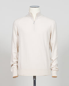Refined Italian knitwear with timeless appeal. This Gran Sasso half-zip features a supple construction in bone white, designed for layering versatility and everyday sophistication. The relaxed silhouette pairs seamlessly with tailored trousers or casual wear, while premium yarn quality ensures durability and comfort through seasons of wear. A refined essential for the discerning wardrobe.