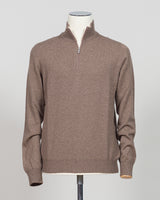 A refined essential in luxurious wool. Gran Sasso's half-zip knit in taupe delivers effortless sophistication with a timeless silhouette that transitions seamlessly across seasons. The soft, breathable construction ensures comfort whether layered under a blazer or worn as a standalone piece. Perfect for those who appreciate understated quality and versatile wardrobe foundations.