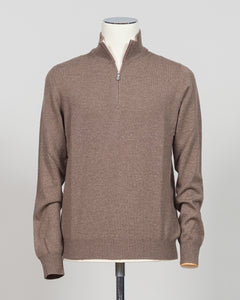 A refined essential in luxurious wool. Gran Sasso's half-zip knit in taupe delivers effortless sophistication with a timeless silhouette that transitions seamlessly across seasons. The soft, breathable construction ensures comfort whether layered under a blazer or worn as a standalone piece. Perfect for those who appreciate understated quality and versatile wardrobe foundations.