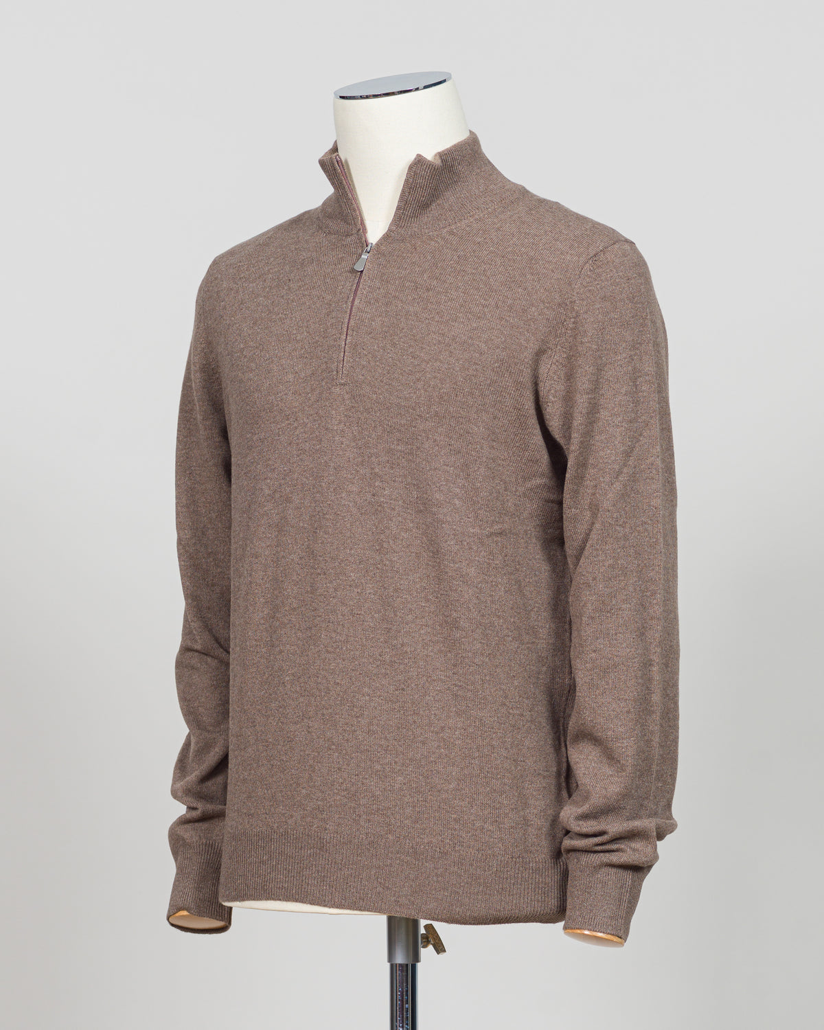 A refined essential in luxurious wool. Gran Sasso's half-zip knit in taupe delivers effortless sophistication with a timeless silhouette that transitions seamlessly across seasons. The soft, breathable construction ensures comfort whether layered under a blazer or worn as a standalone piece. Perfect for those who appreciate understated quality and versatile wardrobe foundations.