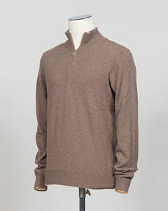 A refined essential in luxurious wool. Gran Sasso's half-zip knit in taupe delivers effortless sophistication with a timeless silhouette that transitions seamlessly across seasons. The soft, breathable construction ensures comfort whether layered under a blazer or worn as a standalone piece. Perfect for those who appreciate understated quality and versatile wardrobe foundations.