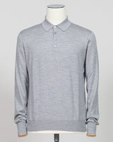 Refined elegance meets tactile luxury in this Gran Sasso polo, crafted from a sophisticated blend of wool, cashmere, and silk. The silver tone offers understated versatility across seasons, while the premium fiber composition delivers exceptional softness and breathability. A timeless essential for the discerning wardrobe. Gran Sasso Wool Cashmere &amp; Silk Polo / Silver