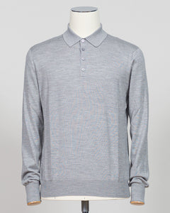 Refined elegance meets tactile luxury in this Gran Sasso polo, crafted from a sophisticated blend of wool, cashmere, and silk. The silver tone offers understated versatility across seasons, while the premium fiber composition delivers exceptional softness and breathability. A timeless essential for the discerning wardrobe. Gran Sasso Wool Cashmere &amp; Silk Polo / Silver