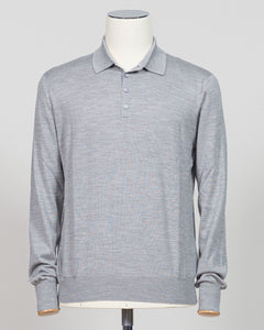Refined elegance meets tactile luxury in this Gran Sasso polo, crafted from a sophisticated blend of wool, cashmere, and silk. The silver tone offers understated versatility across seasons, while the premium fiber composition delivers exceptional softness and breathability. A timeless essential for the discerning wardrobe. Gran Sasso Wool Cashmere &amp; Silk Polo / Silver