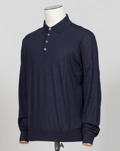 A dark navy blue long-sleeve polo shirt displayed on a white mannequin torso against a light gray background.  Italian craftsmanship meets refined versatility. This Gran Sasso polo blends wool, cashmere, and silk for a lightweight, luxurious knit that transitions effortlessly from casual to elevated dressing. The navy colorway pairs with virtually any tailoring. Premium construction and natural fiber content ensure durability and comfort across seasons. Gran Sasso Wool Cashmere &amp; Silk Polo / Navy