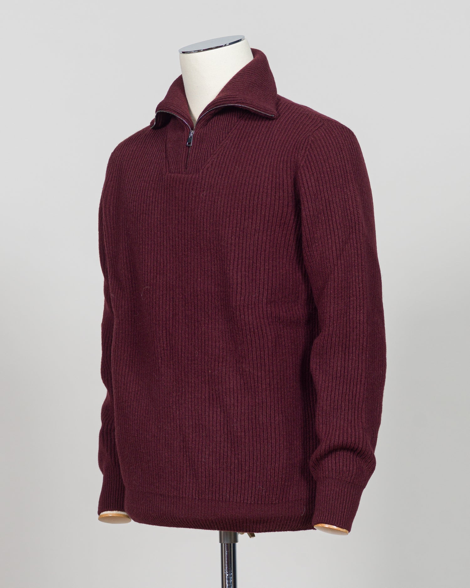 A timeless essential from G.R.P. Firenze, this ribbed half-zip knit combines refined Italian craftsmanship with versatile everyday wearability. The structured ribbed texture adds visual interest and dimension, while the half-zip design allows effortless layering and temperature control. Rendered in a sophisticated blue that transitions seamlessly from office to casual settings, this piece pairs equally well with tailored trousers or denim. A refined foundation for any discerning wardrobe.