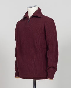A timeless essential from G.R.P. Firenze, this ribbed half-zip knit combines refined Italian craftsmanship with versatile everyday wearability. The structured ribbed texture adds visual interest and dimension, while the half-zip design allows effortless layering and temperature control. Rendered in a sophisticated blue that transitions seamlessly from office to casual settings, this piece pairs equally well with tailored trousers or denim. A refined foundation for any discerning wardrobe.