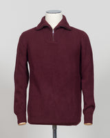 A timeless essential from G.R.P. Firenze, this ribbed half-zip knit combines refined Italian craftsmanship with versatile everyday wearability. The structured ribbed texture adds visual interest and dimension, while the half-zip design allows effortless layering and temperature control. Rendered in a sophisticated blue that transitions seamlessly from office to casual settings, this piece pairs equally well with tailored trousers or denim. A refined foundation for any discerning wardrobe.