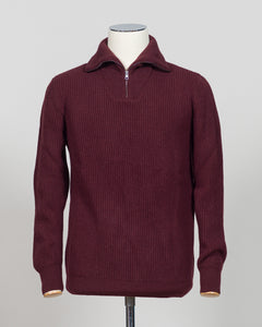 A timeless essential from G.R.P. Firenze, this ribbed half-zip knit combines refined Italian craftsmanship with versatile everyday wearability. The structured ribbed texture adds visual interest and dimension, while the half-zip design allows effortless layering and temperature control. Rendered in a sophisticated blue that transitions seamlessly from office to casual settings, this piece pairs equally well with tailored trousers or denim. A refined foundation for any discerning wardrobe.
