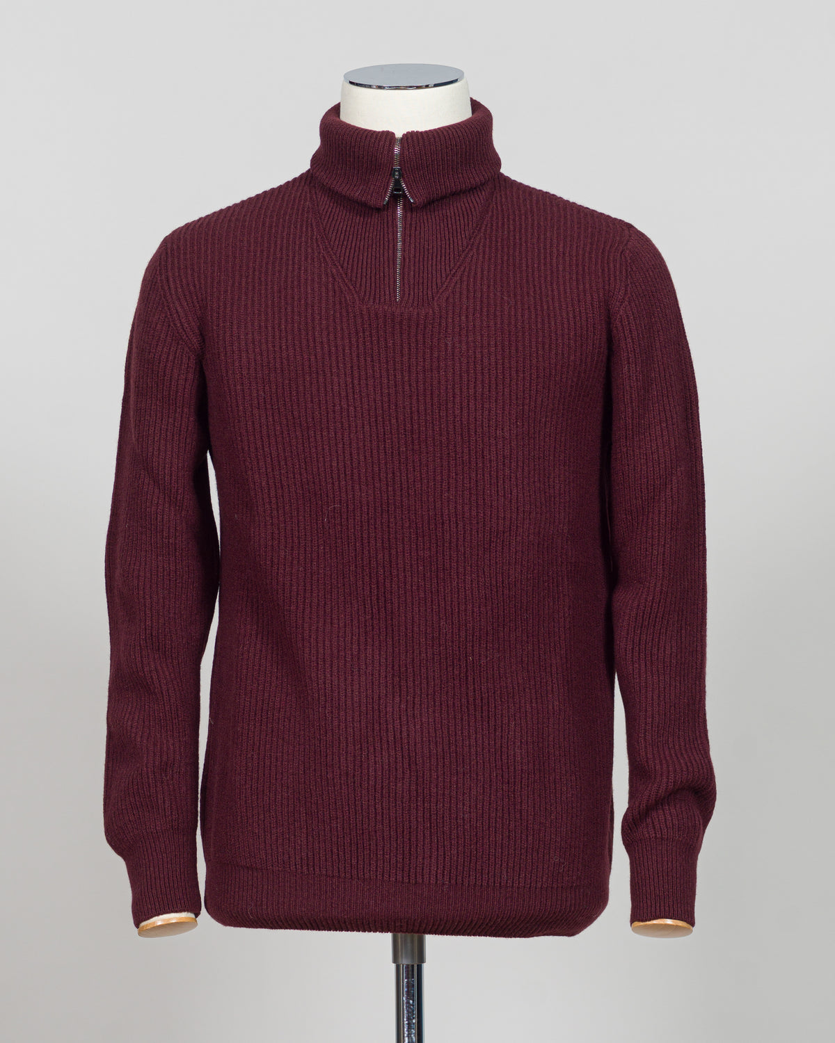 A timeless essential from G.R.P. Firenze, this ribbed half-zip knit combines refined Italian craftsmanship with versatile everyday wearability. The structured ribbed texture adds visual interest and dimension, while the half-zip design allows effortless layering and temperature control. Rendered in a sophisticated blue that transitions seamlessly from office to casual settings, this piece pairs equally well with tailored trousers or denim. A refined foundation for any discerning wardrobe.