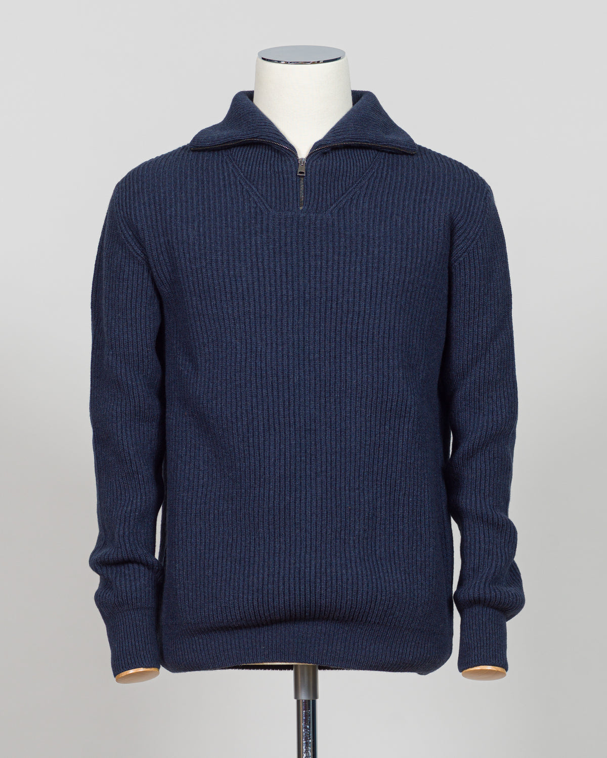 A timeless essential from G.R.P. Firenze, this ribbed half-zip knit combines refined Italian craftsmanship with versatile everyday wearability. The structured ribbed texture adds visual interest and dimension, while the half-zip design allows effortless layering and temperature control. Rendered in a sophisticated blue that transitions seamlessly from office to casual settings, this piece pairs equally well with tailored trousers or denim. A refined foundation for any discerning wardrobe.