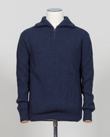 A timeless essential from G.R.P. Firenze, this ribbed half-zip knit combines refined Italian craftsmanship with versatile everyday wearability. The structured ribbed texture adds visual interest and dimension, while the half-zip design allows effortless layering and temperature control. Rendered in a sophisticated blue that transitions seamlessly from office to casual settings, this piece pairs equally well with tailored trousers or denim. A refined foundation for any discerning wardrobe.