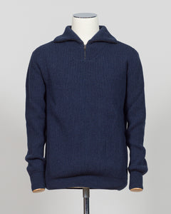 A timeless essential from G.R.P. Firenze, this ribbed half-zip knit combines refined Italian craftsmanship with versatile everyday wearability. The structured ribbed texture adds visual interest and dimension, while the half-zip design allows effortless layering and temperature control. Rendered in a sophisticated blue that transitions seamlessly from office to casual settings, this piece pairs equally well with tailored trousers or denim. A refined foundation for any discerning wardrobe.