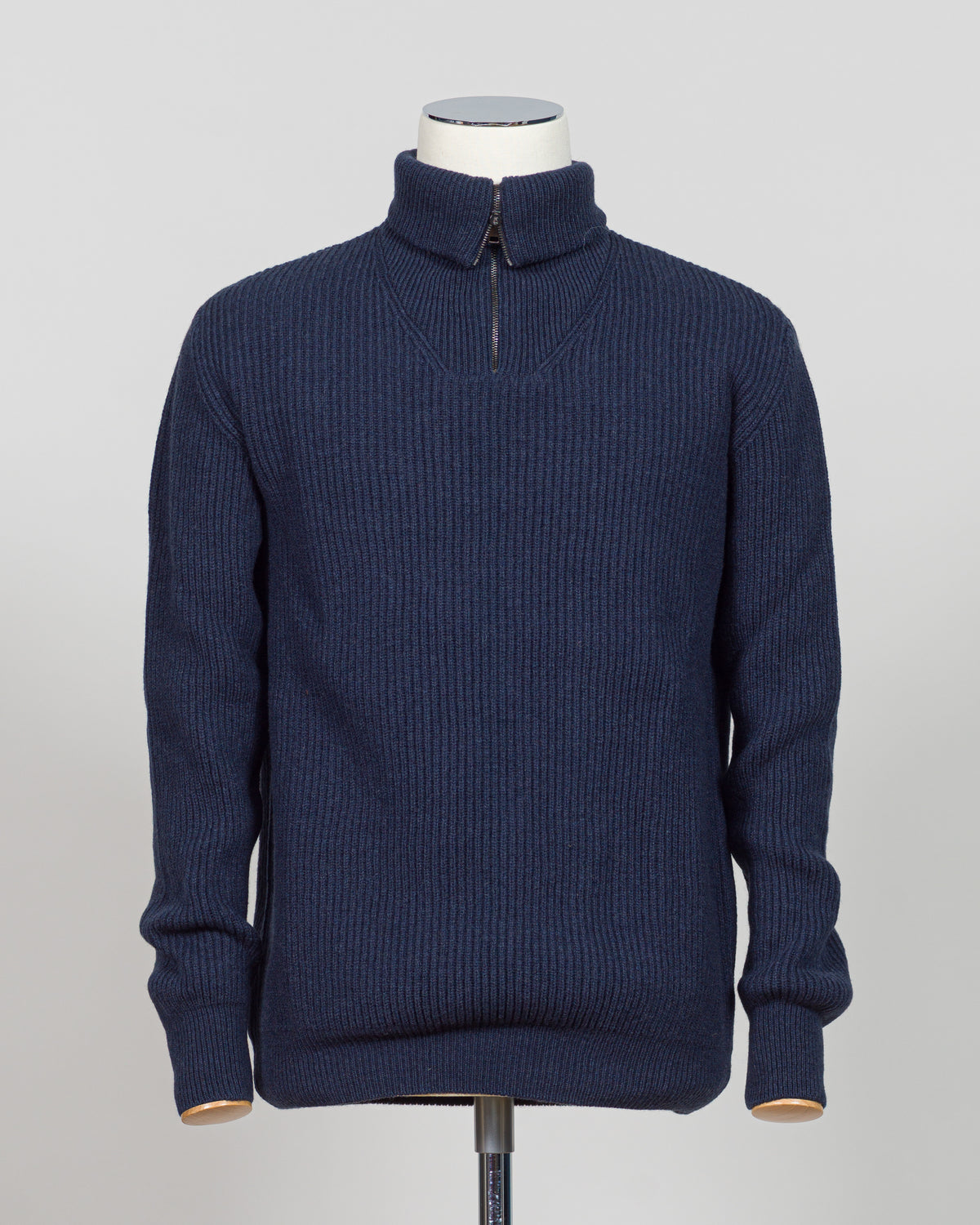 A timeless essential from G.R.P. Firenze, this ribbed half-zip knit combines refined Italian craftsmanship with versatile everyday wearability. The structured ribbed texture adds visual interest and dimension, while the half-zip design allows effortless layering and temperature control. Rendered in a sophisticated blue that transitions seamlessly from office to casual settings, this piece pairs equally well with tailored trousers or denim. A refined foundation for any discerning wardrobe.