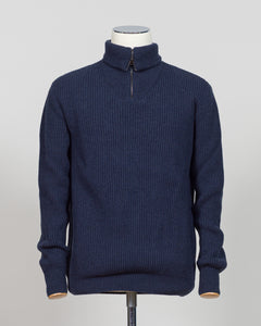 A timeless essential from G.R.P. Firenze, this ribbed half-zip knit combines refined Italian craftsmanship with versatile everyday wearability. The structured ribbed texture adds visual interest and dimension, while the half-zip design allows effortless layering and temperature control. Rendered in a sophisticated blue that transitions seamlessly from office to casual settings, this piece pairs equally well with tailored trousers or denim. A refined foundation for any discerning wardrobe.