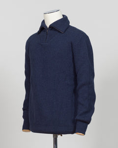 A timeless essential from G.R.P. Firenze, this ribbed half-zip knit combines refined Italian craftsmanship with versatile everyday wearability. The structured ribbed texture adds visual interest and dimension, while the half-zip design allows effortless layering and temperature control. Rendered in a sophisticated blue that transitions seamlessly from office to casual settings, this piece pairs equally well with tailored trousers or denim. A refined foundation for any discerning wardrobe.