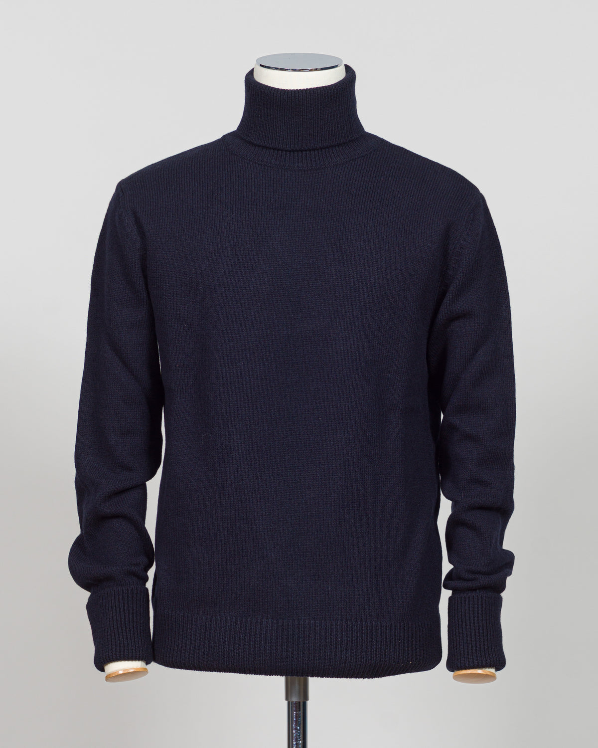 Crafted from premium Italian yarn, the G.R.P. Firenze rollneck knit delivers refined simplicity with architectural precision. The navy tone pairs seamlessly with tailored pieces, while the structured rollneck and clean finish reflect the meticulous construction standards of contemporary menswear. Ideal for layering or worn as a statement piece, this knit bridges casual elegance with wardrobing versatility.