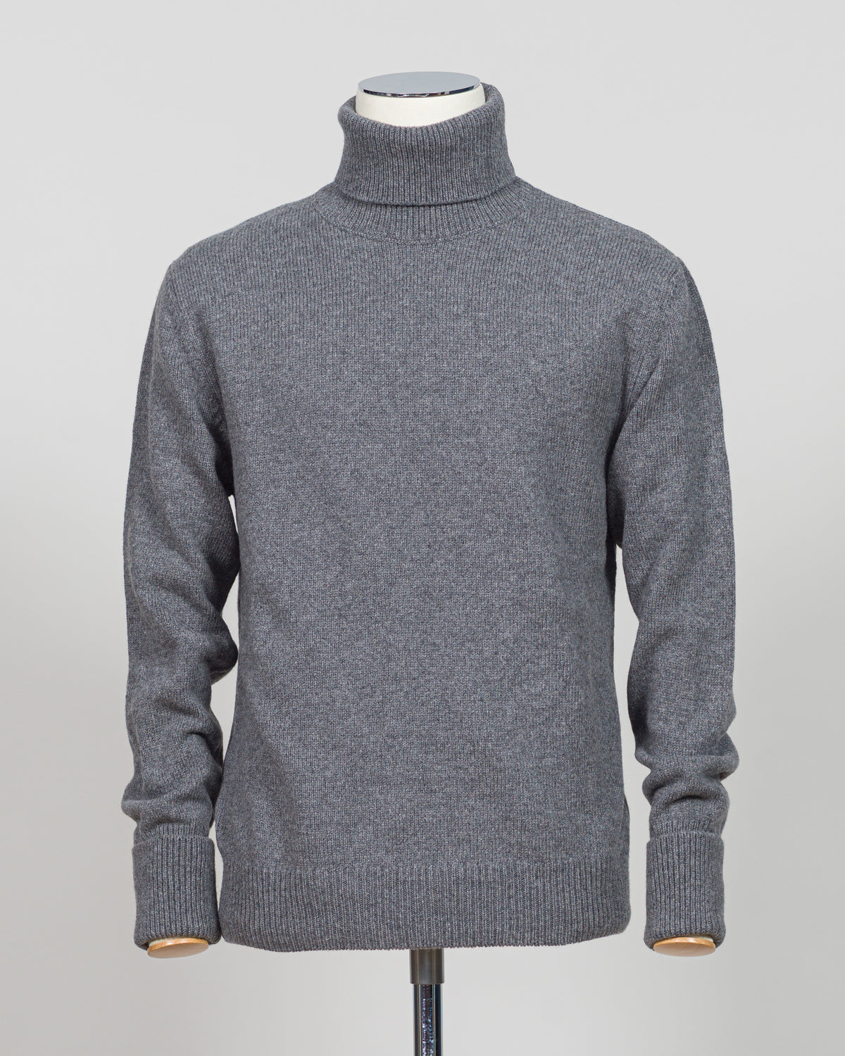 Crafted from premium Italian yarn, the G.R.P. Firenze rollneck knit delivers refined simplicity with architectural precision. The elevated grey tone pairs seamlessly with tailored pieces, while the structured rollneck and clean finish reflect the meticulous construction standards of contemporary menswear. Ideal for layering or worn as a statement piece, this knit bridges casual elegance with wardrobing versatility.