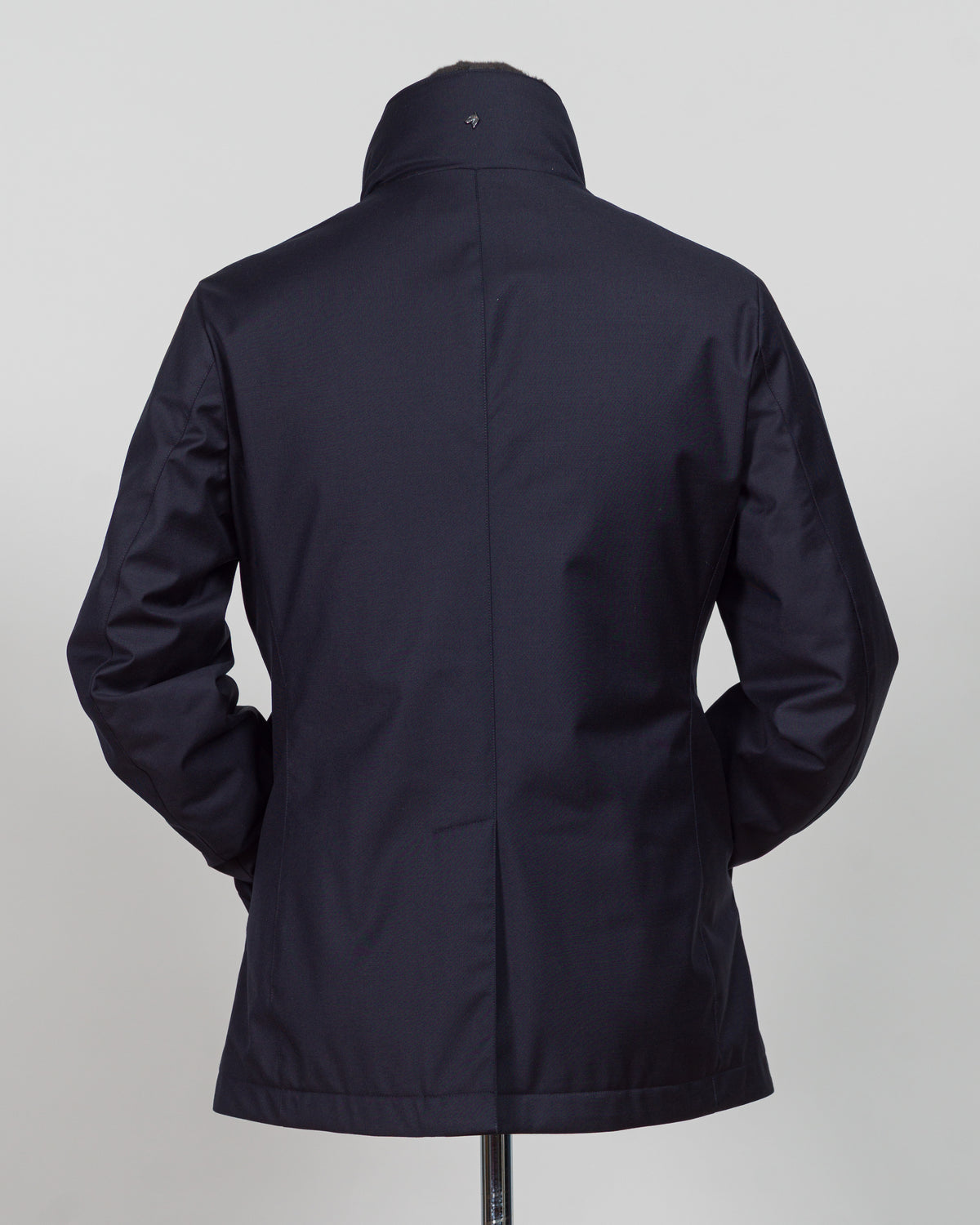 Montecore's double-breasted down jacket combines Italian tailoring precision with practical outerwear design. Navy wool outer with premium down filling delivers warmth without bulk, while structured shoulders and clean lines reflect luxury menswear craftsmanship. Horn buttons and internal quilting detail elevate everyday wear.

Perfect for layering across seasons—wear over knitwear or dress shirts. The relaxed yet refined silhouette suits both smart-casual and dressier occasions. Wind and water-resistant fi