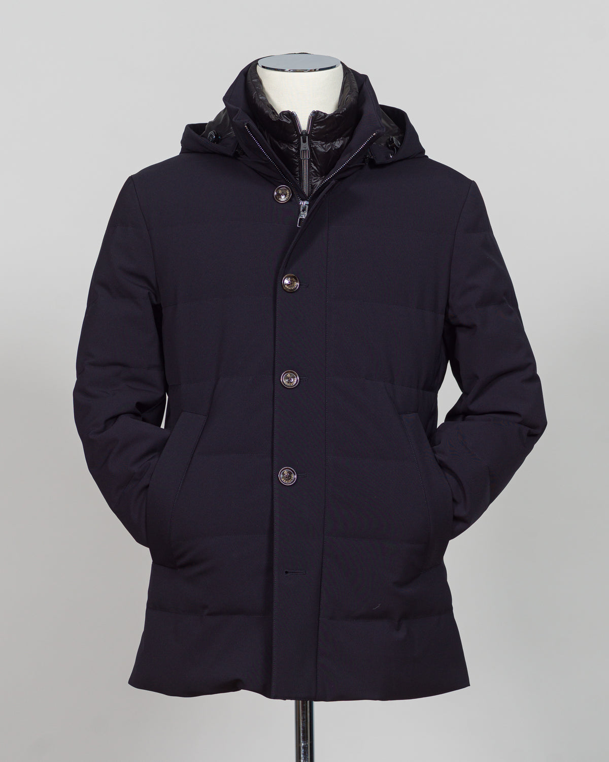 The Montecore Aerotwill Down Jacket combines lightweight insulation with weather-resistant performance. Crafted from premium aerotwill fabric, this navy jacket traps warmth without bulk, making it ideal for layering through transitional seasons or wearing as a standalone piece in mild conditions. The down fill provides responsive loft and compressibility for easy packing and storage. Cut with a refined silhouette that works seamlessly with tailored pieces, this jacket bridges casual functionality and polish