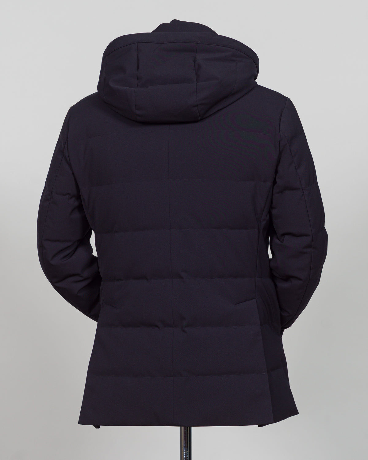 The Montecore Aerotwill Down Jacket combines lightweight insulation with weather-resistant performance. Crafted from premium aerotwill fabric, this navy jacket traps warmth without bulk, making it ideal for layering through transitional seasons or wearing as a standalone piece in mild conditions. The down fill provides responsive loft and compressibility for easy packing and storage. Cut with a refined silhouette that works seamlessly with tailored pieces, this jacket bridges casual functionality and polish