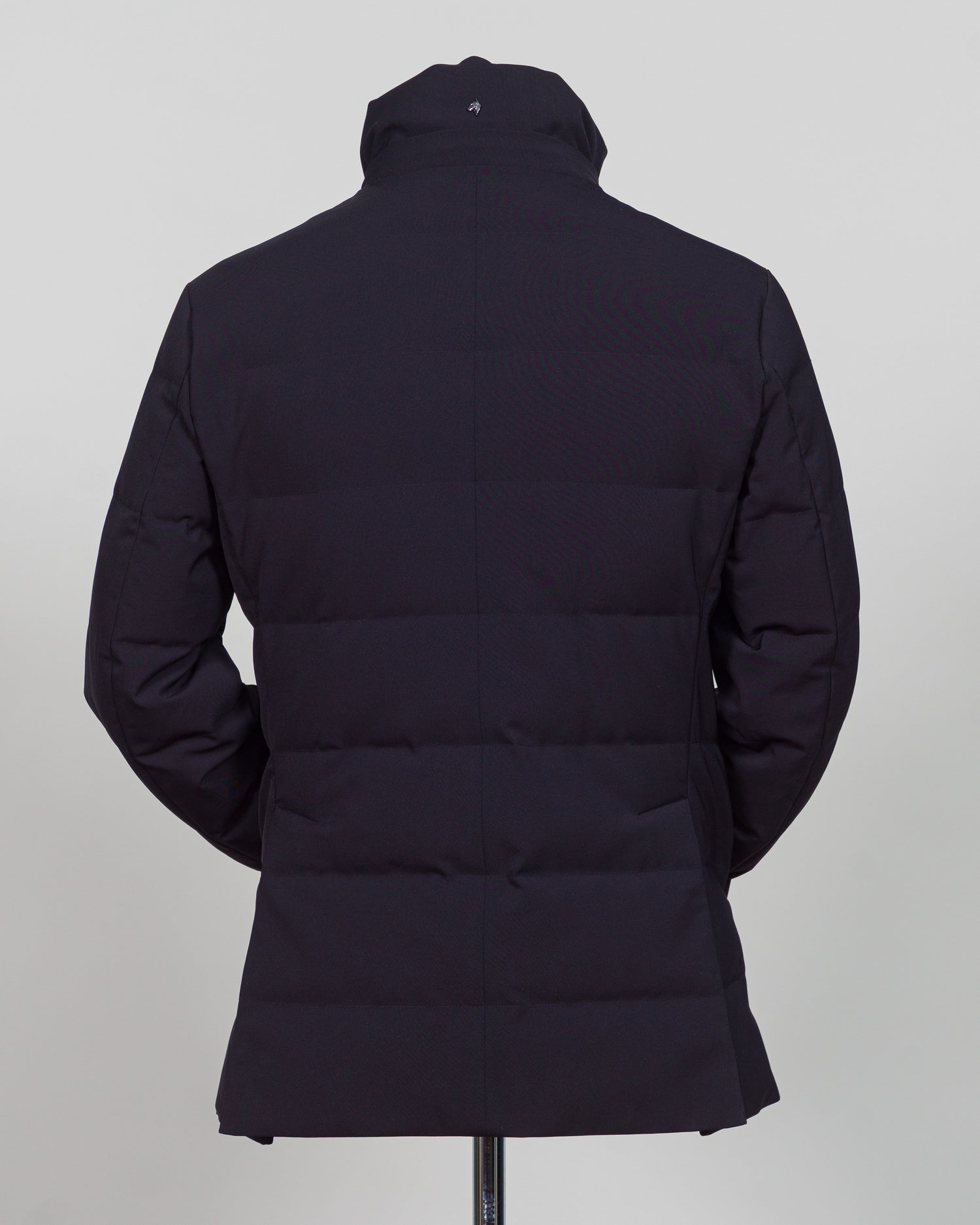 The Montecore Aerotwill Down Jacket combines lightweight insulation with weather-resistant performance. Crafted from premium aerotwill fabric, this navy jacket traps warmth without bulk, making it ideal for layering through transitional seasons or wearing as a standalone piece in mild conditions. The down fill provides responsive loft and compressibility for easy packing and storage. Cut with a refined silhouette that works seamlessly with tailored pieces, this jacket bridges casual functionality and polish
