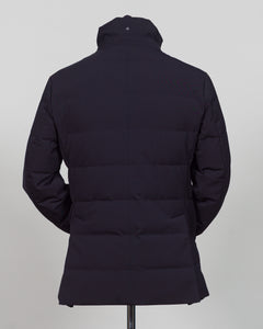 The Montecore Aerotwill Down Jacket combines lightweight insulation with weather-resistant performance. Crafted from premium aerotwill fabric, this navy jacket traps warmth without bulk, making it ideal for layering through transitional seasons or wearing as a standalone piece in mild conditions. The down fill provides responsive loft and compressibility for easy packing and storage. Cut with a refined silhouette that works seamlessly with tailored pieces, this jacket bridges casual functionality and polish