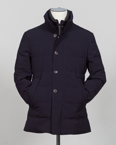 The Montecore Aerotwill Down Jacket combines lightweight insulation with weather-resistant performance. Crafted from premium aerotwill fabric, this navy jacket traps warmth without bulk, making it ideal for layering through transitional seasons or wearing as a standalone piece in mild conditions. The down fill provides responsive loft and compressibility for easy packing and storage. Cut with a refined silhouette that works seamlessly with tailored pieces, this jacket bridges casual functionality and polish