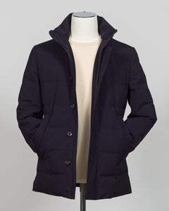 The Montecore Aerotwill Down Jacket combines lightweight insulation with weather-resistant performance. Crafted from premium aerotwill fabric, this navy jacket traps warmth without bulk, making it ideal for layering through transitional seasons or wearing as a standalone piece in mild conditions. The down fill provides responsive loft and compressibility for easy packing and storage. Cut with a refined silhouette that works seamlessly with tailored pieces, this jacket bridges casual functionality and polish