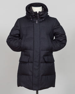 The Montecore VBC Flannel Down Coat delivers refined warmth with understated sophistication. Crafted from premium VBC flannel in deep charcoal grey, this jacket balances structure and comfort for versatile layering across seasons.

Filled with responsibly sourced down insulation, it provides exceptional thermal efficiency without excess bulk. The classic silhouette suits tailored wardrobes—layer it over dress shirts for office wear or pair casually with knitwear for weekend elegance.

VBC's heritage Italian