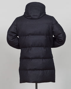 The Montecore VBC Flannel Down Coat delivers refined warmth with understated sophistication. Crafted from premium VBC flannel in deep charcoal grey, this jacket balances structure and comfort for versatile layering across seasons.

Filled with responsibly sourced down insulation, it provides exceptional thermal efficiency without excess bulk. The classic silhouette suits tailored wardrobes—layer it over dress shirts for office wear or pair casually with knitwear for weekend elegance.

VBC's heritage Italian