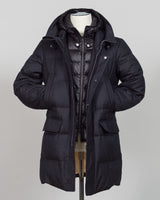 The Montecore VBC Flannel Down Coat delivers refined warmth with understated sophistication. Crafted from premium VBC flannel in deep charcoal grey, this jacket balances structure and comfort for versatile layering across seasons.

Filled with responsibly sourced down insulation, it provides exceptional thermal efficiency without excess bulk. The classic silhouette suits tailored wardrobes—layer it over dress shirts for office wear or pair casually with knitwear for weekend elegance.

VBC's heritage Italian