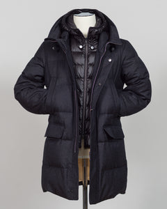 The Montecore VBC Flannel Down Coat delivers refined warmth with understated sophistication. Crafted from premium VBC flannel in deep charcoal grey, this jacket balances structure and comfort for versatile layering across seasons.

Filled with responsibly sourced down insulation, it provides exceptional thermal efficiency without excess bulk. The classic silhouette suits tailored wardrobes—layer it over dress shirts for office wear or pair casually with knitwear for weekend elegance.

VBC's heritage Italian