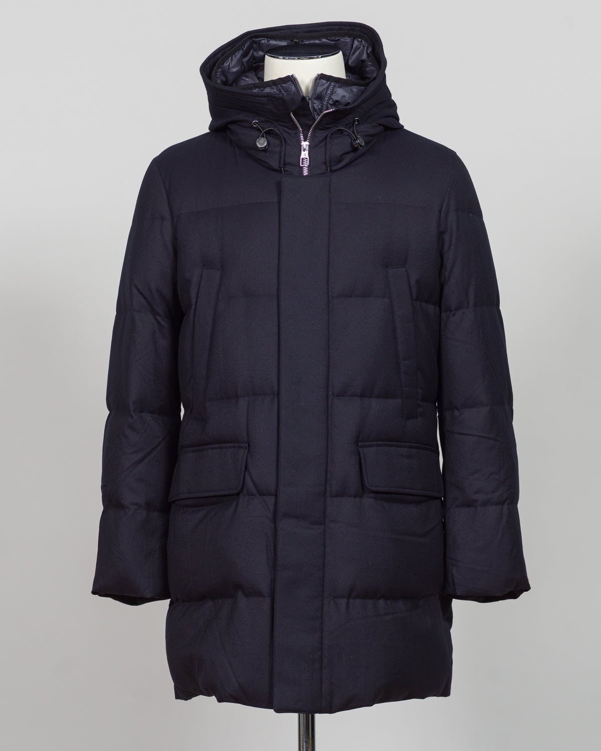 The Montecore VBC Flannel Down Coat delivers refined warmth with understated sophistication. Crafted from premium VBC flannel in navy, this jacket balances structure and comfort for versatile layering across seasons.

Filled with responsibly sourced down insulation, it provides exceptional thermal efficiency without excess bulk. The classic silhouette suits tailored wardrobes—layer it over dress shirts for office wear or pair casually with knitwear for weekend elegance.

VBC's heritage Italian mills ensure 