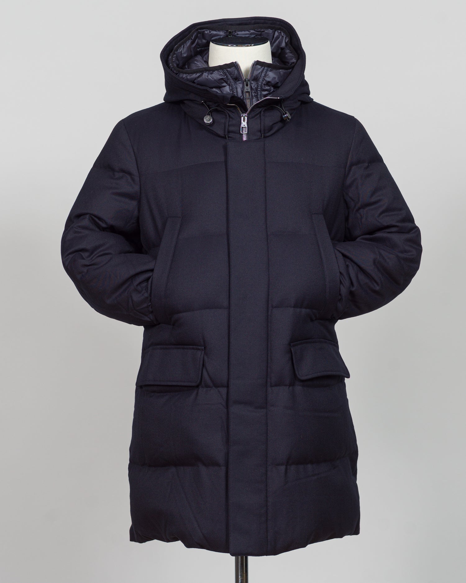 The Montecore VBC Flannel Down Coat delivers refined warmth with understated sophistication. Crafted from premium VBC flannel in navy, this jacket balances structure and comfort for versatile layering across seasons.

Filled with responsibly sourced down insulation, it provides exceptional thermal efficiency without excess bulk. The classic silhouette suits tailored wardrobes—layer it over dress shirts for office wear or pair casually with knitwear for weekend elegance.

VBC's heritage Italian mills ensure 