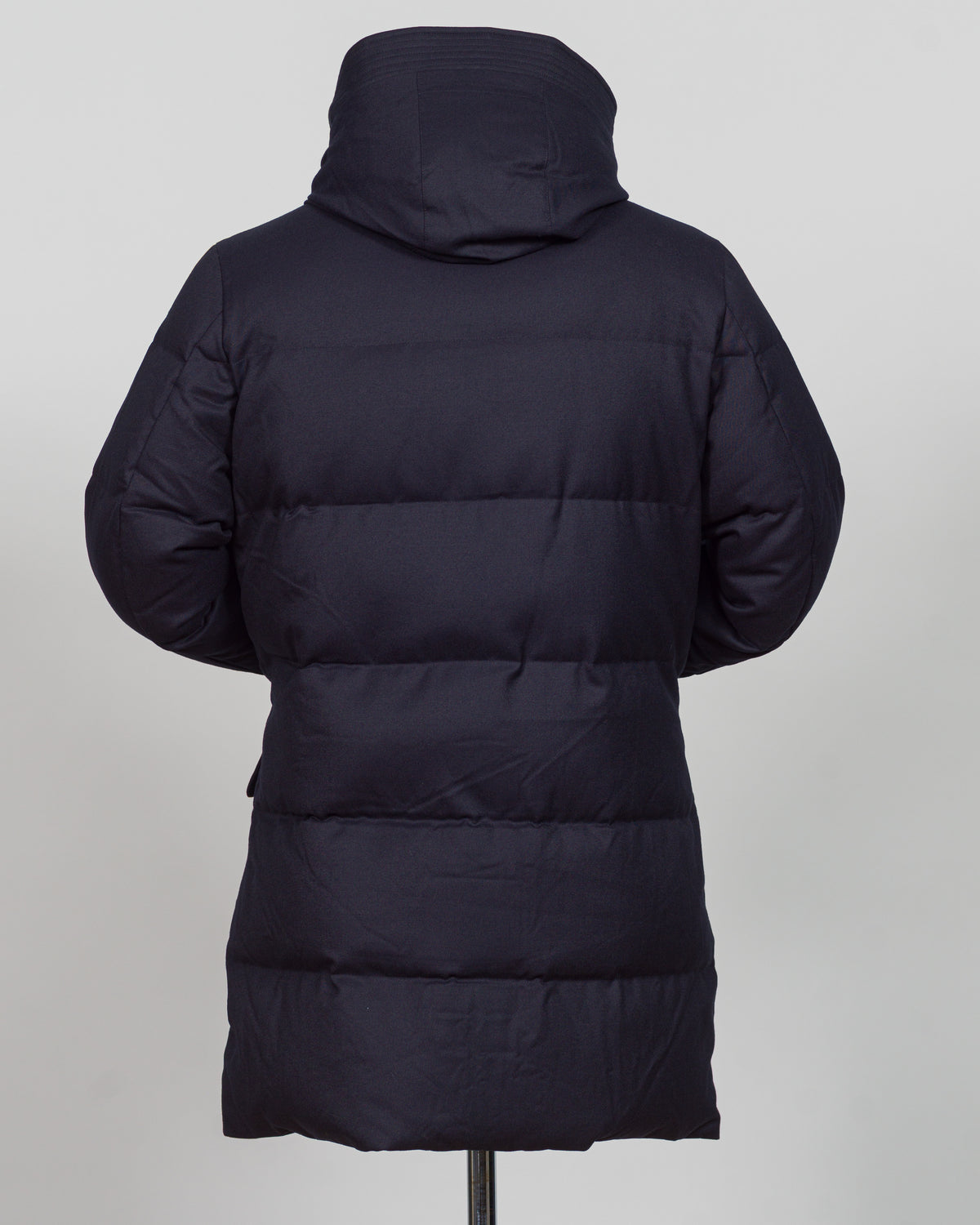 The Montecore VBC Flannel Down Coat delivers refined warmth with understated sophistication. Crafted from premium VBC flannel in navy, this jacket balances structure and comfort for versatile layering across seasons.

Filled with responsibly sourced down insulation, it provides exceptional thermal efficiency without excess bulk. The classic silhouette suits tailored wardrobes—layer it over dress shirts for office wear or pair casually with knitwear for weekend elegance.

VBC's heritage Italian mills ensure 