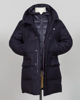 The Montecore VBC Flannel Down Coat delivers refined warmth with understated sophistication. Crafted from premium VBC flannel in navy, this jacket balances structure and comfort for versatile layering across seasons.

Filled with responsibly sourced down insulation, it provides exceptional thermal efficiency without excess bulk. The classic silhouette suits tailored wardrobes—layer it over dress shirts for office wear or pair casually with knitwear for weekend elegance.

VBC's heritage Italian mills ensure 