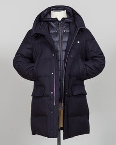 The Montecore VBC Flannel Down Coat delivers refined warmth with understated sophistication. Crafted from premium VBC flannel in navy, this jacket balances structure and comfort for versatile layering across seasons.

Filled with responsibly sourced down insulation, it provides exceptional thermal efficiency without excess bulk. The classic silhouette suits tailored wardrobes—layer it over dress shirts for office wear or pair casually with knitwear for weekend elegance.

VBC's heritage Italian mills ensure 